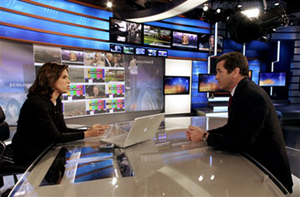 CNN’s Soledad O’Brien, left, and Miles O’Brien rehearse with the network’s “news wall” in the background.