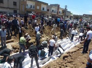 AFP photo. burying victims of the Houla massacre